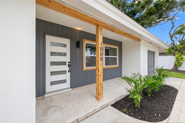 1050 55th Ave S, Saint Petersburg, FL 33705 - entrance to property featuring stucco siding and a porch