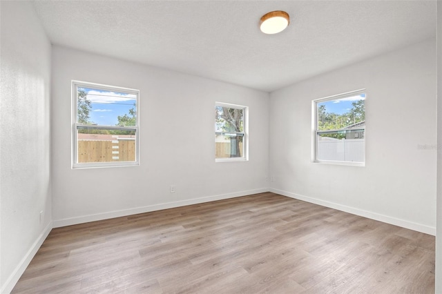1050 55th Ave S, Saint Petersburg, FL 33705 - spare room featuring plenty of natural light and light wood finished floors