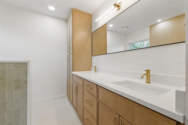 1050 55th Ave S, Saint Petersburg, FL 33705 - full bath with double vanity, recessed lighting, and baseboards