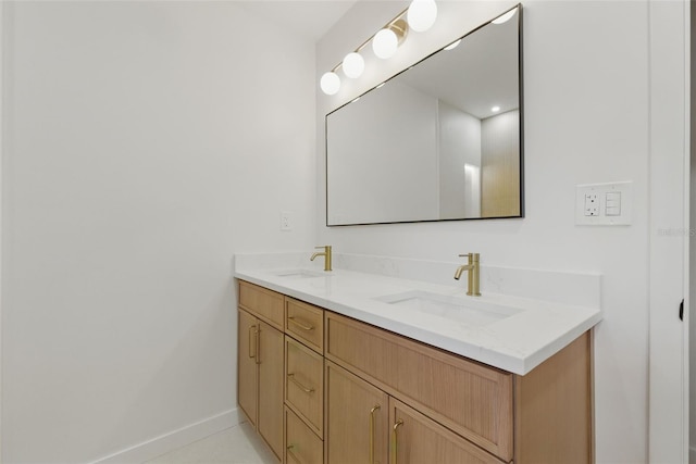 1050 55th Ave S, Saint Petersburg, FL 33705 - bathroom with double vanity and baseboards