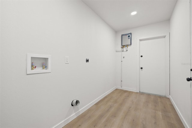 1050 55th Ave S, Saint Petersburg, FL 33705 - laundry area with electric dryer hookup, light wood-type flooring, washer hookup, baseboards, and recessed lighting