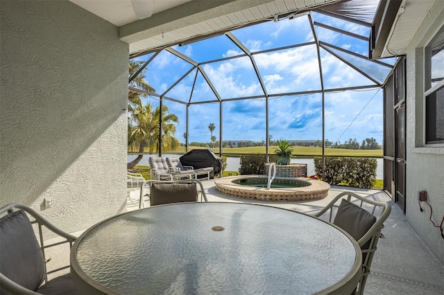 1322 Millbrook Cir, Bradenton, FL 34212 - view of patio / terrace with a lanai, outdoor dining area, an outdoor hot tub, and a water view