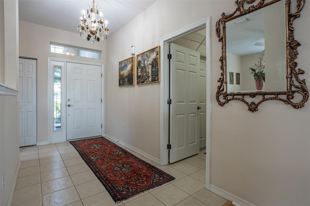 1322 Millbrook Cir, Bradenton, FL 34212 - entryway with an inviting chandelier, baseboards, and light tile patterned floors