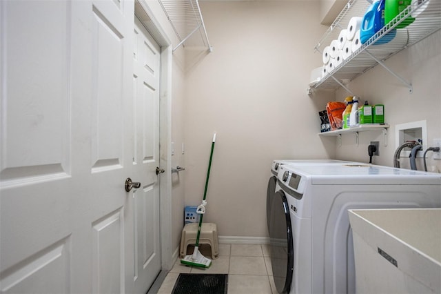 1322 Millbrook Cir, Bradenton, FL 34212 - washroom with baseboards, independent washer and dryer, laundry area, and light tile patterned floors