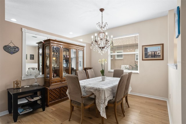 1322 Millbrook Cir, Bradenton, FL 34212 - dining space featuring a chandelier, light wood-style floors, baseboards, and recessed lighting