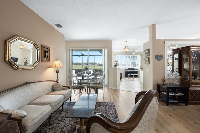 1322 Millbrook Cir, Bradenton, FL 34212 - living room featuring light wood finished floors and visible vents
