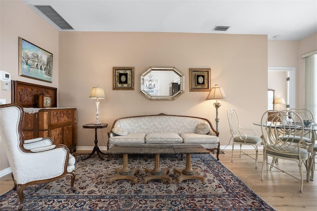 1322 Millbrook Cir, Bradenton, FL 34212 - sitting room featuring wood finished floors, visible vents, and baseboards