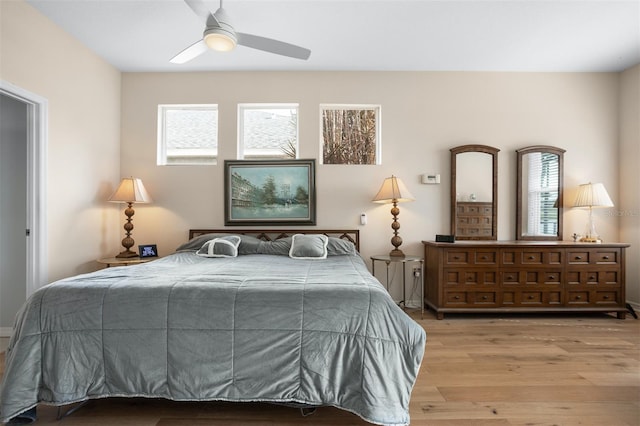 1322 Millbrook Cir, Bradenton, FL 34212 - bedroom with wood finished floors, ceiling fan, and multiple windows