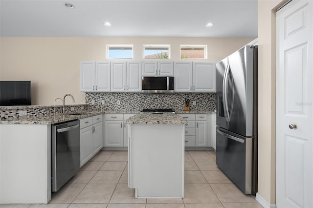 1322 Millbrook Cir, Bradenton, FL 34212 - kitchen with decorative backsplash, stainless steel appliances, a sink, and a healthy amount of sunlight