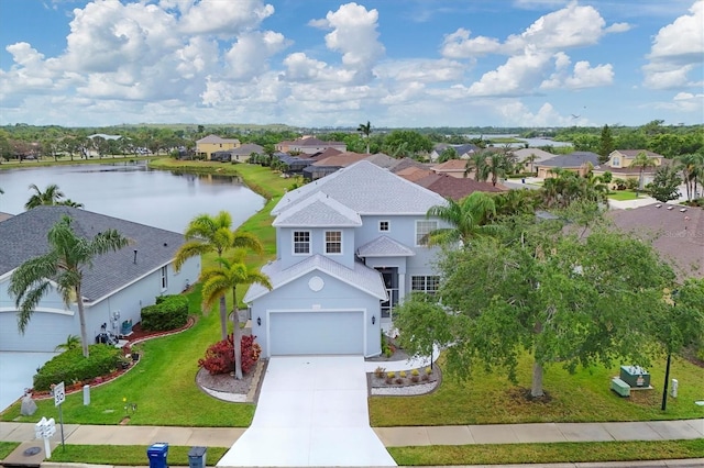 bird's eye view with a water view and a residential view