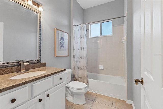 bathroom with tile patterned flooring, shower / tub combo, vanity, and toilet