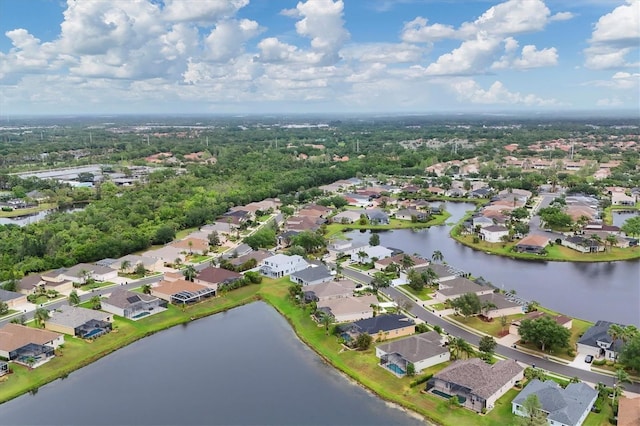 drone / aerial view featuring a water view and a residential view