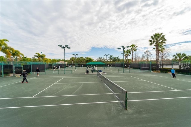 view of tennis court with fence
