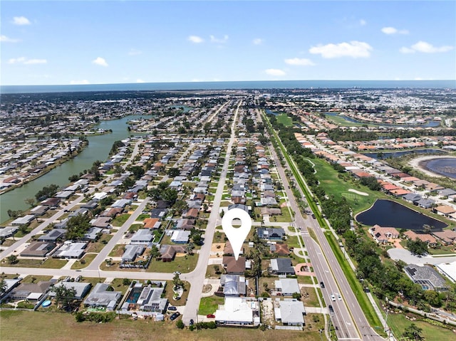 bird's eye view featuring a residential view and a water view