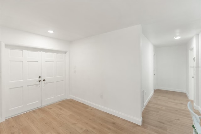 entrance foyer with baseboards, light wood-type flooring, and recessed lighting