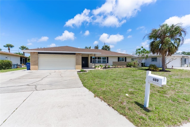 ranch-style home with a garage, driveway, a front lawn, and brick siding