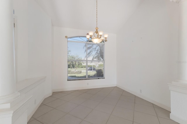 unfurnished dining area with a notable chandelier, vaulted ceiling, and light tile patterned flooring
