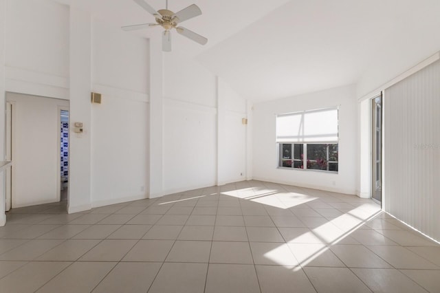 empty room featuring tile patterned floors, a ceiling fan, and high vaulted ceiling