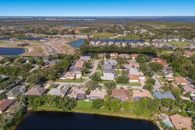 aerial view featuring a residential view and a water view