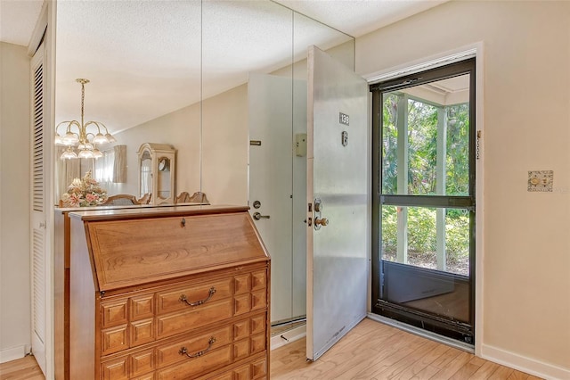 1532 Pelican Point Dr Unit Ba139, Sarasota, FL 34231 - doorway to outside with baseboards and light wood-style floors