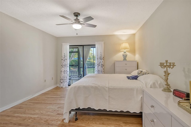 1532 Pelican Point Dr Unit Ba139, Sarasota, FL 34231 - bedroom with light wood finished floors, access to exterior, ceiling fan, and baseboards