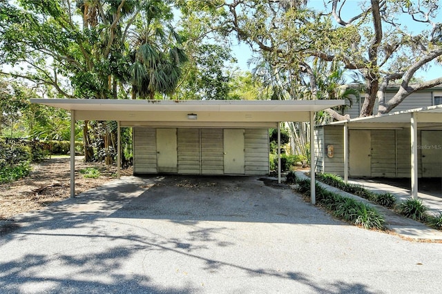 1532 Pelican Point Dr Unit Ba139, Sarasota, FL 34231 - garage with a detached carport and aphalt driveway