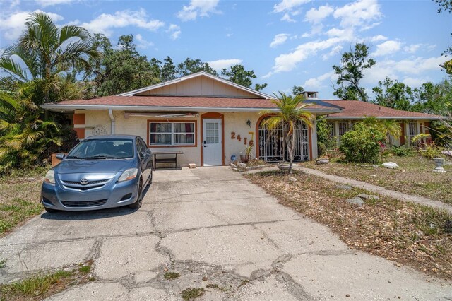 single story home with concrete driveway