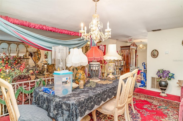dining area with an inviting chandelier and visible vents