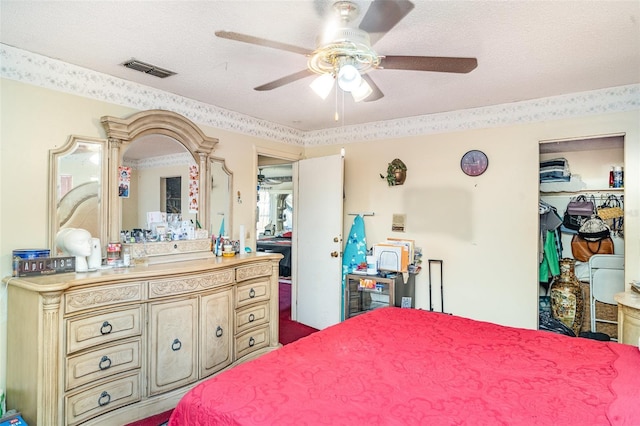 bedroom featuring a ceiling fan and visible vents