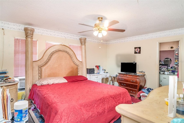 bedroom with a ceiling fan and a textured ceiling