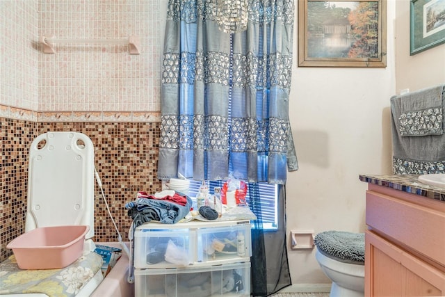 full bath featuring toilet and vanity