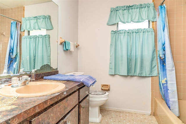 bathroom with vanity, toilet, tile patterned floors, shower / bath combination with curtain, and baseboards