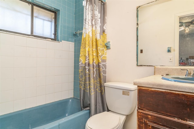 bathroom with toilet, shower / bath combination with curtain, and vanity