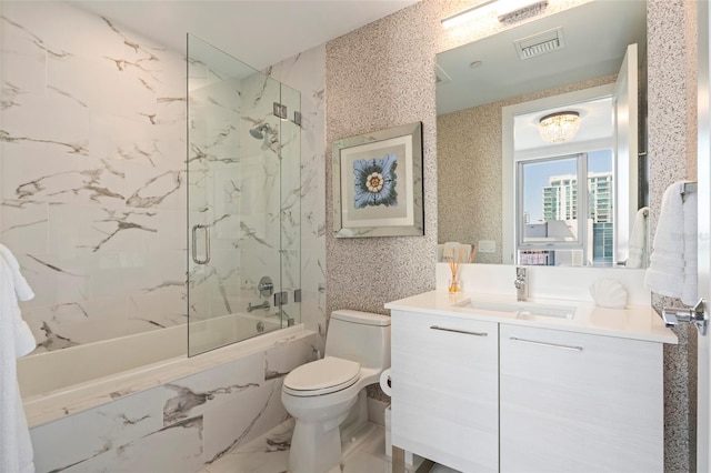 bathroom with vanity, visible vents, toilet, enclosed tub / shower combo, and marble finish floor