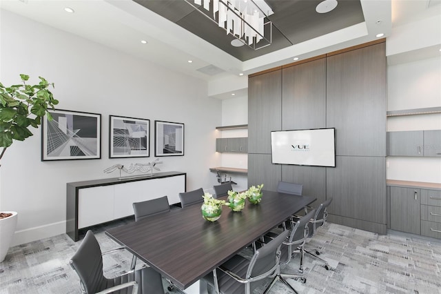 dining room featuring a tray ceiling, baseboards, and recessed lighting