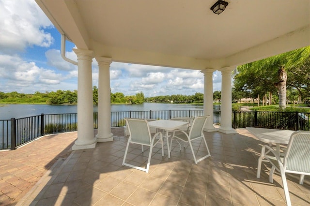 5881 Girona Pl, Sarasota, FL 34238 - view of patio featuring outdoor dining area and a water view