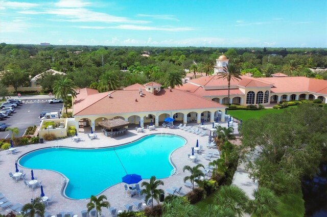 5881 Girona Pl, Sarasota, FL 34238 - community pool featuring a patio area