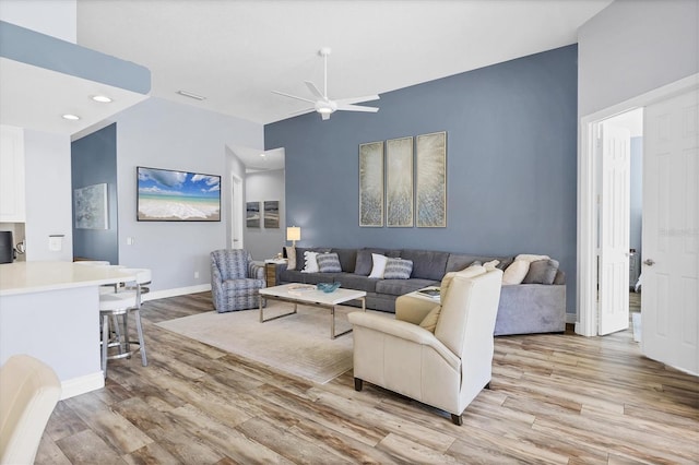 5881 Girona Pl, Sarasota, FL 34238 - living room with a ceiling fan, light wood finished floors, baseboards, and recessed lighting
