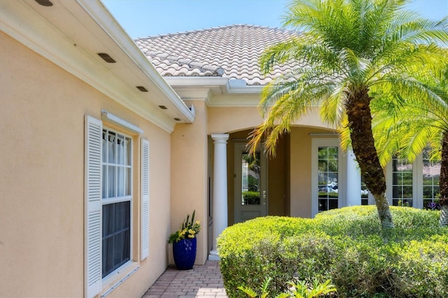 5881 Girona Pl, Sarasota, FL 34238 - property entrance with stucco siding and a tiled roof