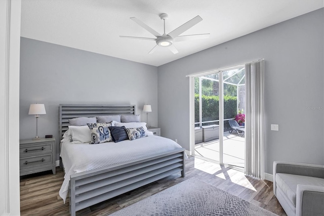 5881 Girona Pl, Sarasota, FL 34238 - bedroom featuring access to exterior, wood finished floors, a ceiling fan, and baseboards