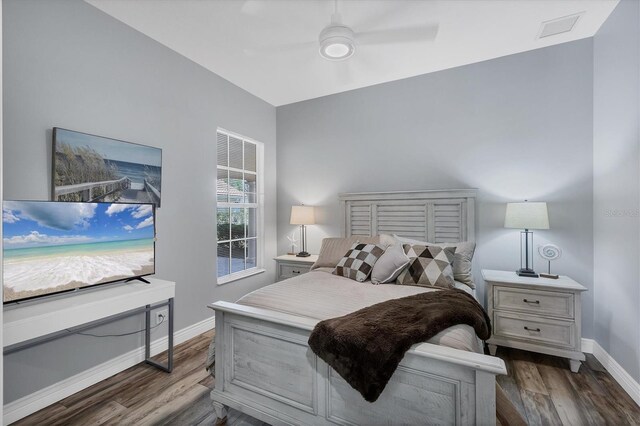 5881 Girona Pl, Sarasota, FL 34238 - bedroom with baseboards, dark wood finished floors, and ceiling fan