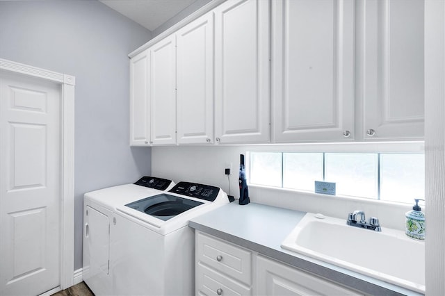 5881 Girona Pl, Sarasota, FL 34238 - laundry room featuring separate washer and dryer and cabinet space