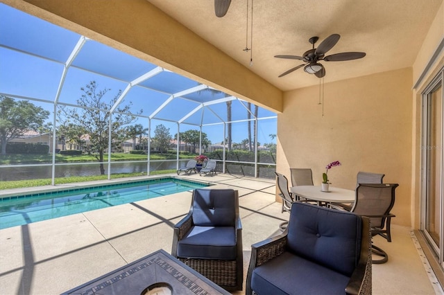 5881 Girona Pl, Sarasota, FL 34238 - swimming pool with a patio, ceiling fan, a water view, and glass enclosure