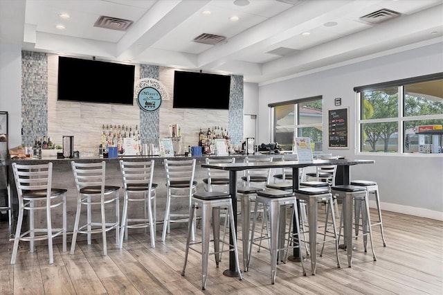 5881 Girona Pl, Sarasota, FL 34238 - indoor wet bar featuring wood finished floors, beamed ceiling, baseboards, decorative backsplash, and recessed lighting