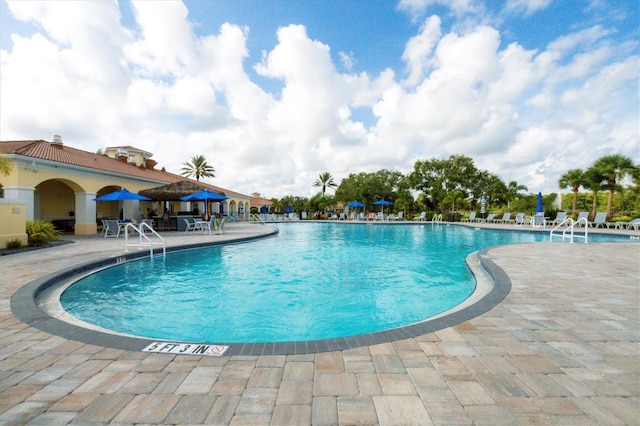 5881 Girona Pl, Sarasota, FL 34238 - community pool featuring a patio
