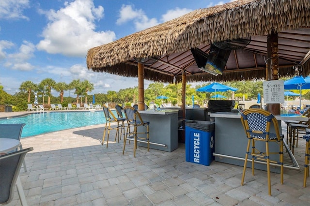 5881 Girona Pl, Sarasota, FL 34238 - view of patio with a community pool