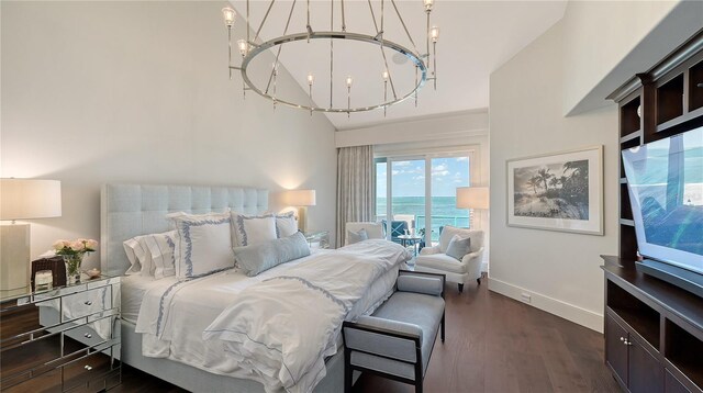 bedroom featuring baseboards, dark wood-style floors, access to outside, and a chandelier