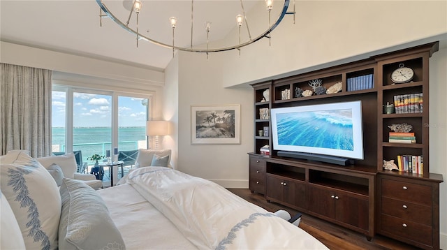 living area featuring baseboards and dark wood-style floors
