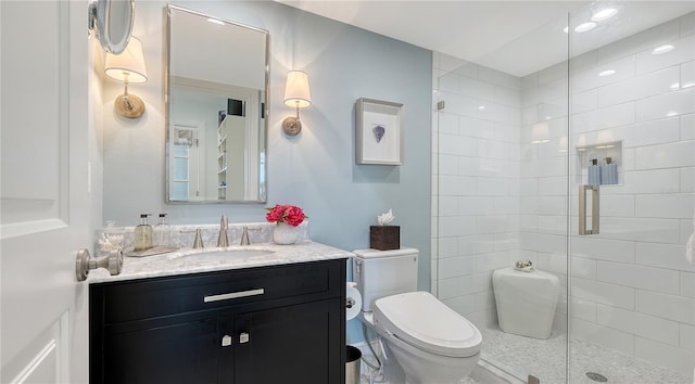 full bathroom featuring vanity, toilet, and a stall shower