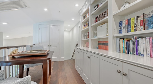interior space featuring dark wood-style flooring, visible vents, and recessed lighting